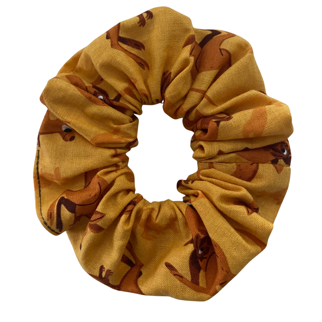 A light brown coloured fabric featuring images of bouncing Kangaroos.