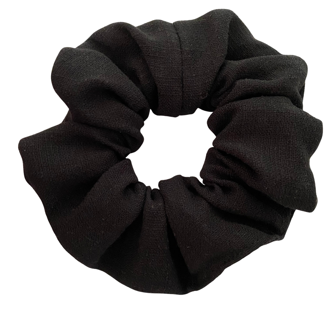 Black linen scrunchie on a white background.