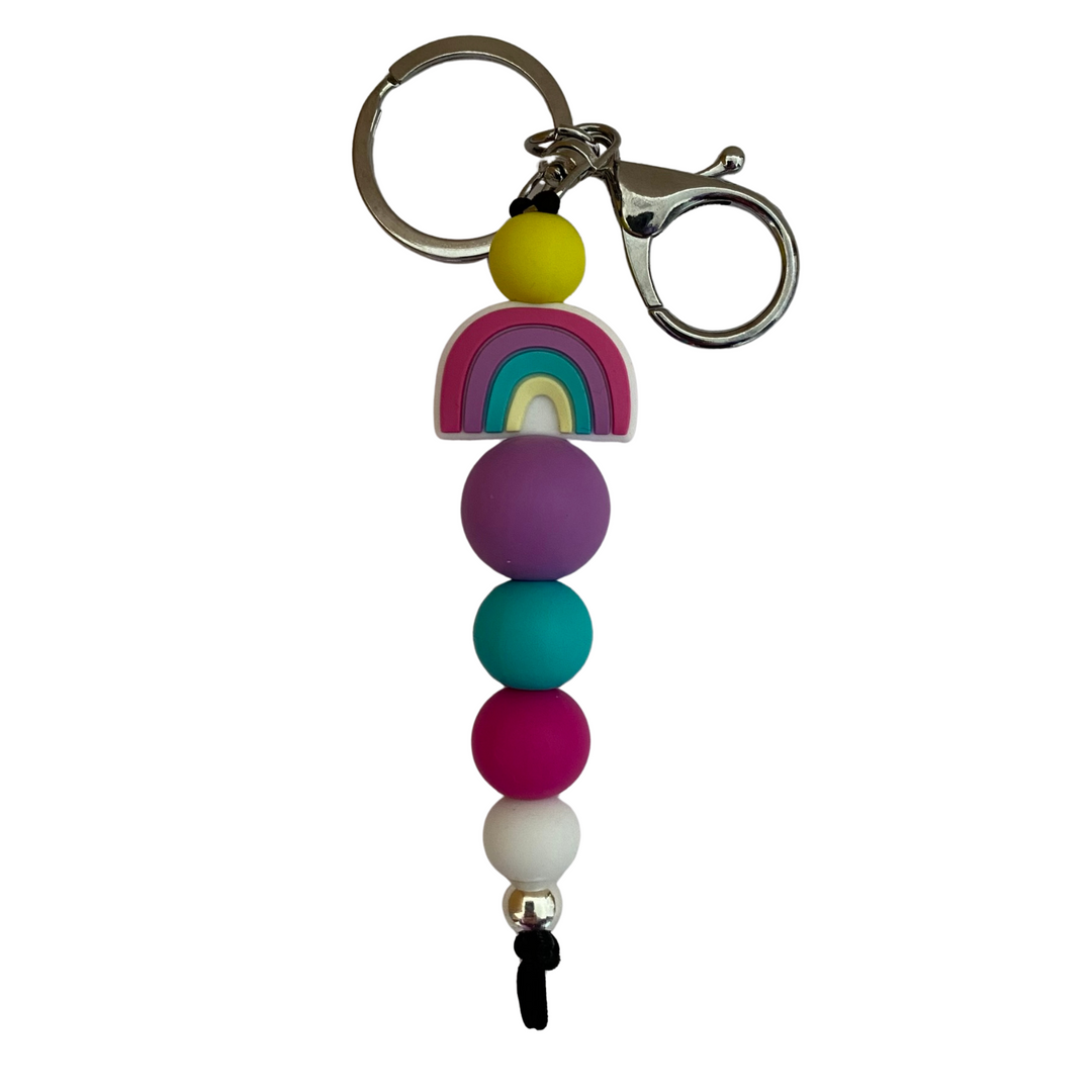 An 18cm keyring featuring a coloured rainbow silicone bead and other coloured round silicone beads.