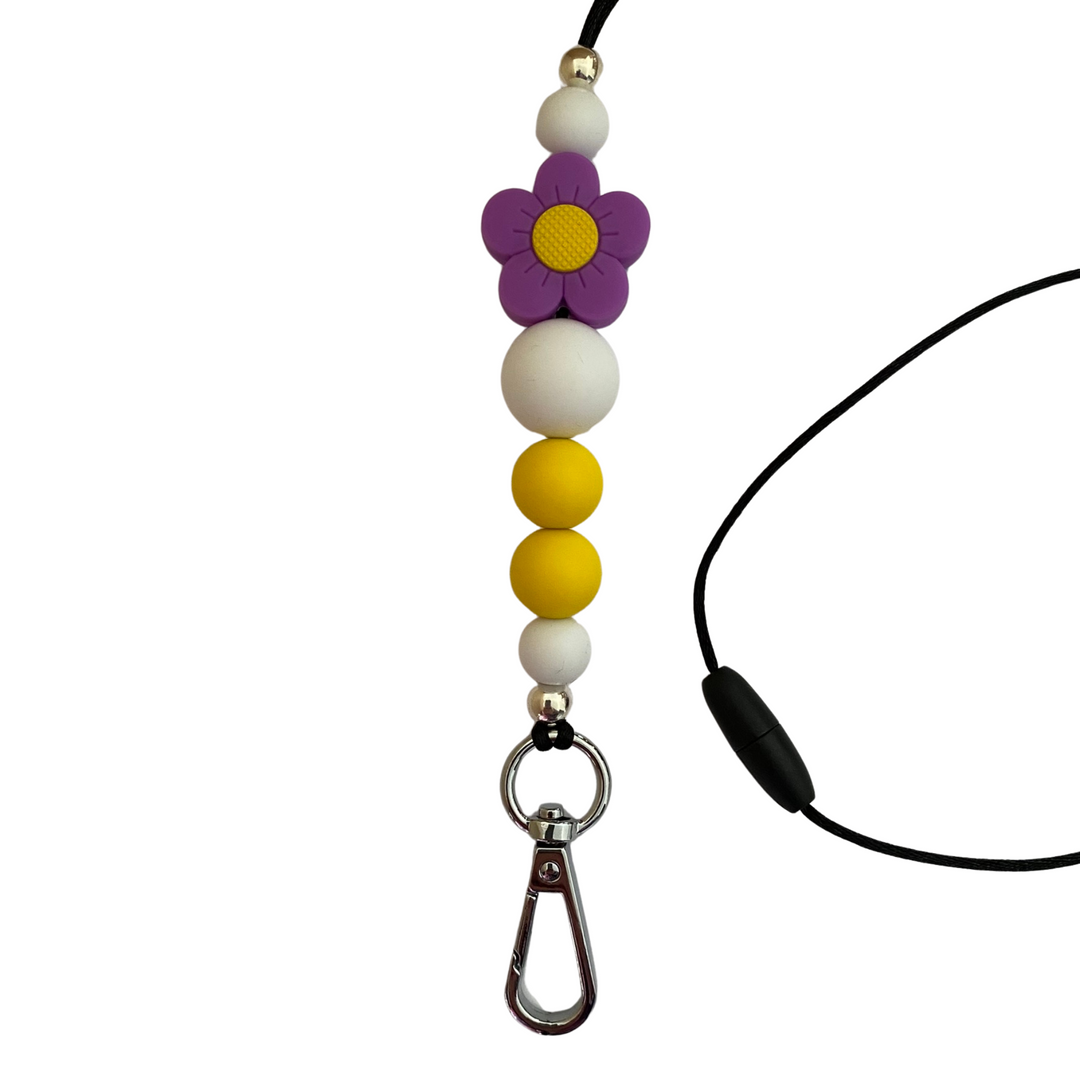 A 60cm lanyard fitted with a safety break away clasp featuring a purple flower silicone bead and other coloured round silicone beads.