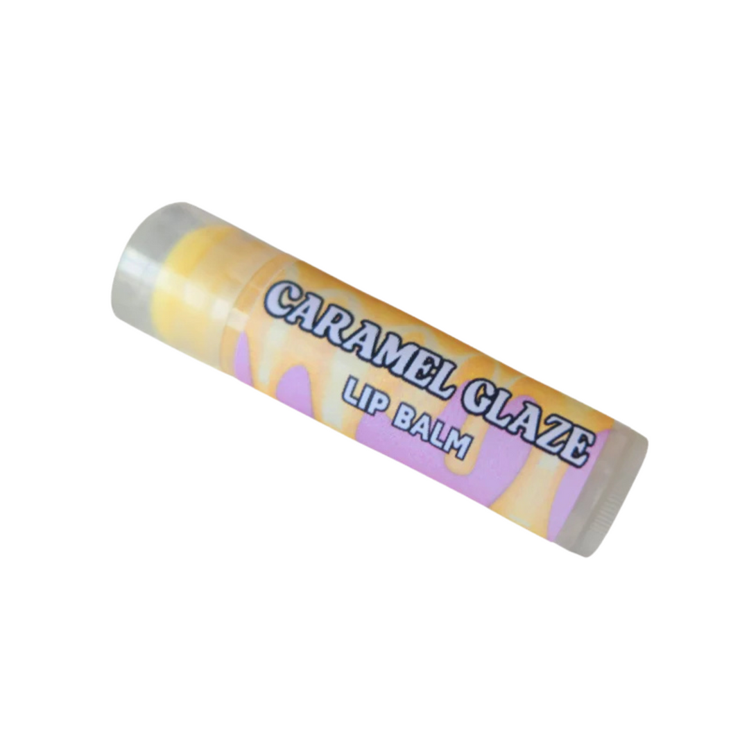Caramel Glaze Lip Balm, flavoured with a decadent blend of sweet, sticky caramel and creamy buttercream vanilla. Hydrates, nourishes, and plumps lips, leaving them soft, smooth, and refreshed all day.