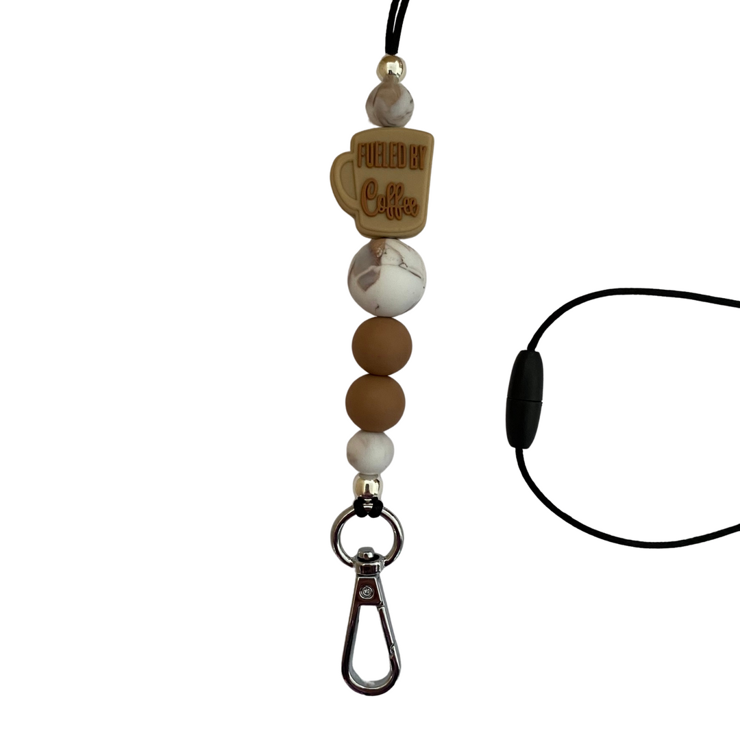 A 60cm lanyard fitted with a safety break away clasp featuring a coffee cup and the words fueled by coffee and other coloured round silicone beads.