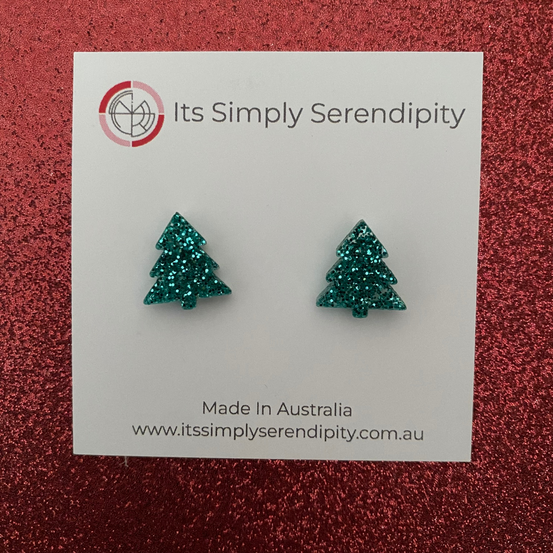 Aqua glittery tree-shaped earrings on a 'Its Simply Serendipity' card with a red glittery background.