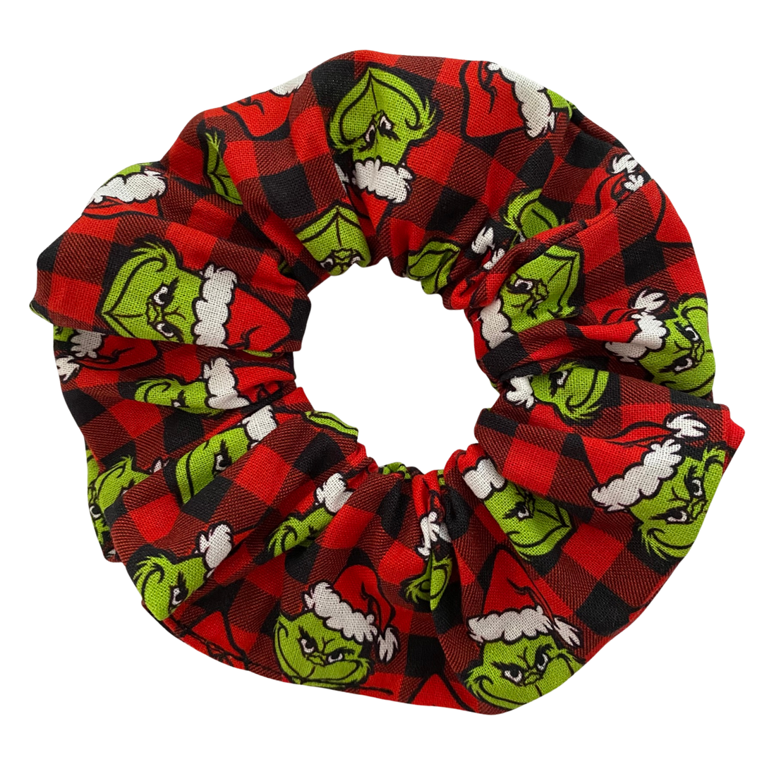 Scrunchie with Grinch pattern on a red and black checkered background
