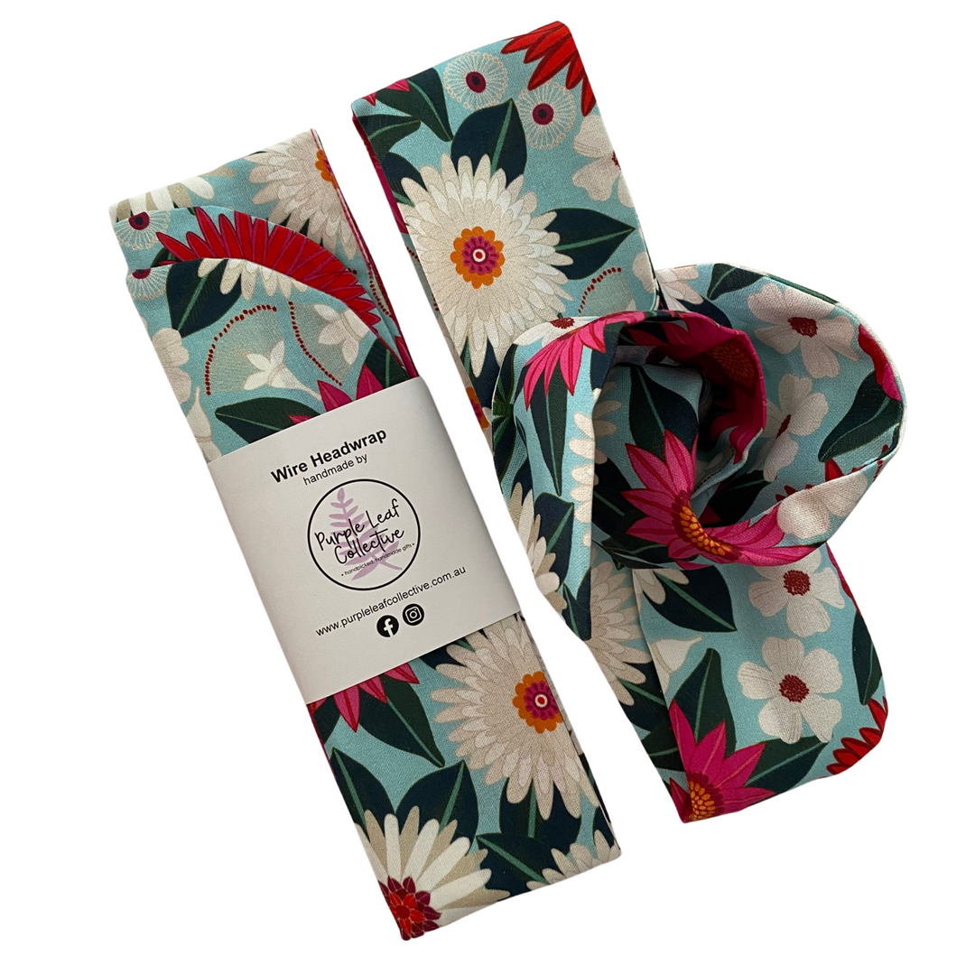 Handmade wire headwrap, headband with deep magenta and white flowers on a aqua blue fabric. Stylish, adjustable, and perfect for all-day wear or hair loss coverage.