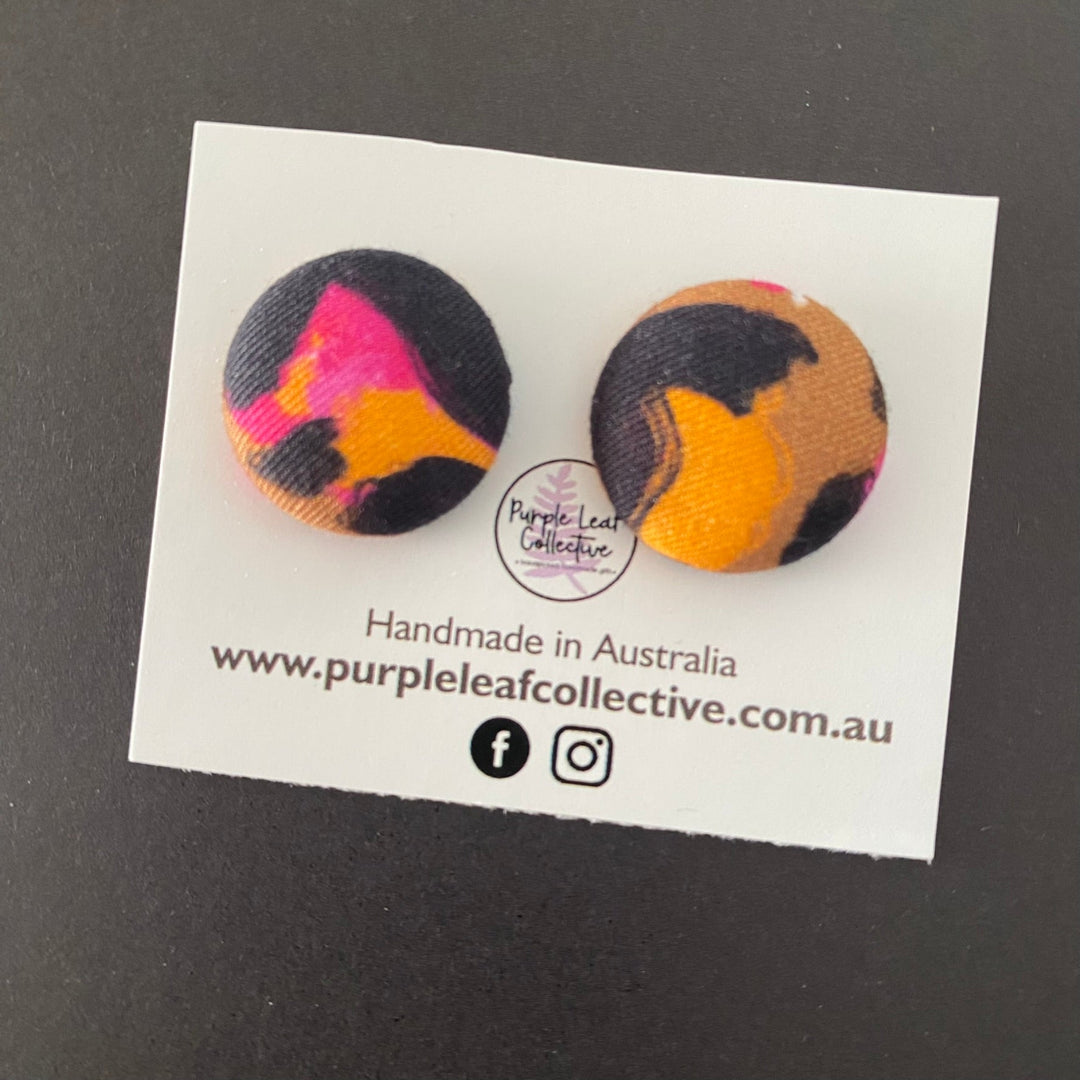 Kasey Rainbow Bronze Leopard fabric button earrings, crafted with vibrant fabric designed by Kasey Rainbow. Handmade with hypoallergenic surgical steel posts which are perfect for sensitive ears.