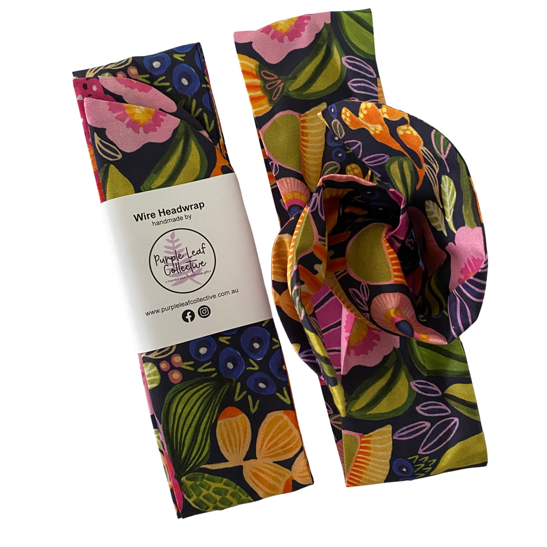 Handmade wire headwrap, headband with colour flowers set on dark blue colour fabric by Kirsten Katz. Stylish, adjustable, and perfect for all-day wear or hair loss coverage.