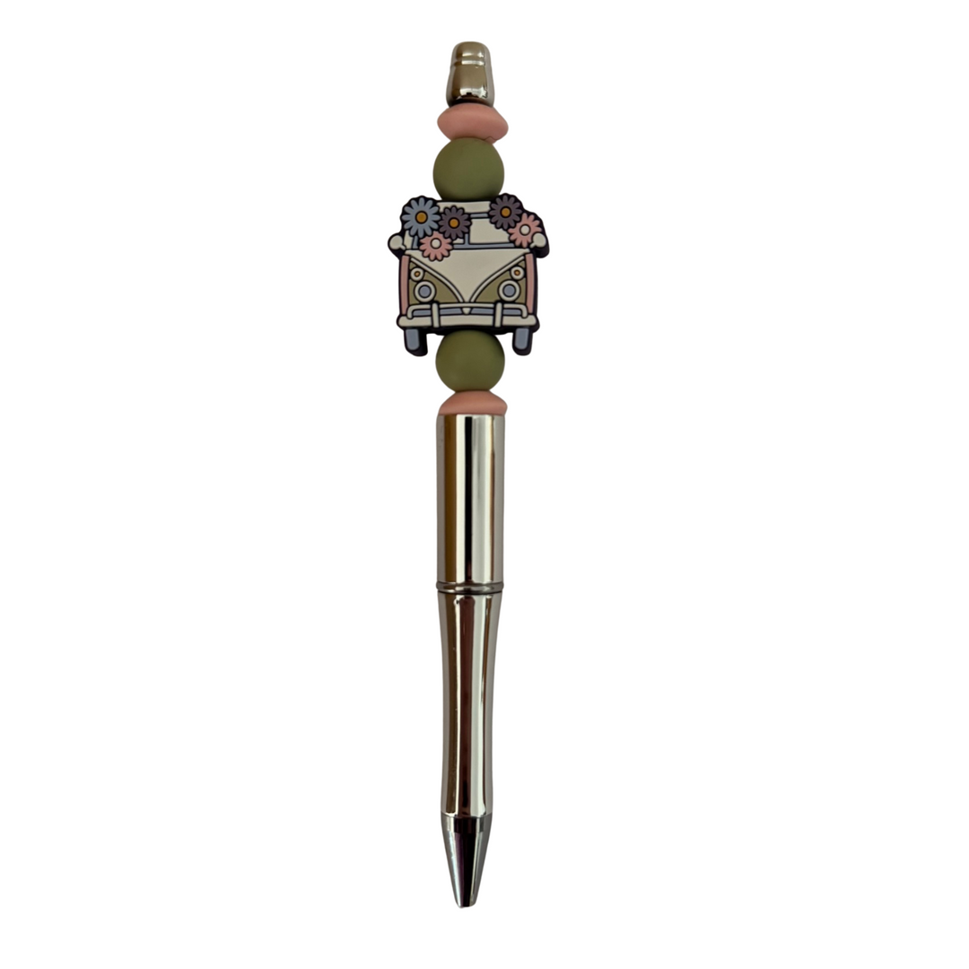 A refillable black ink pen with a Kombi and flowers silicone bead on top.