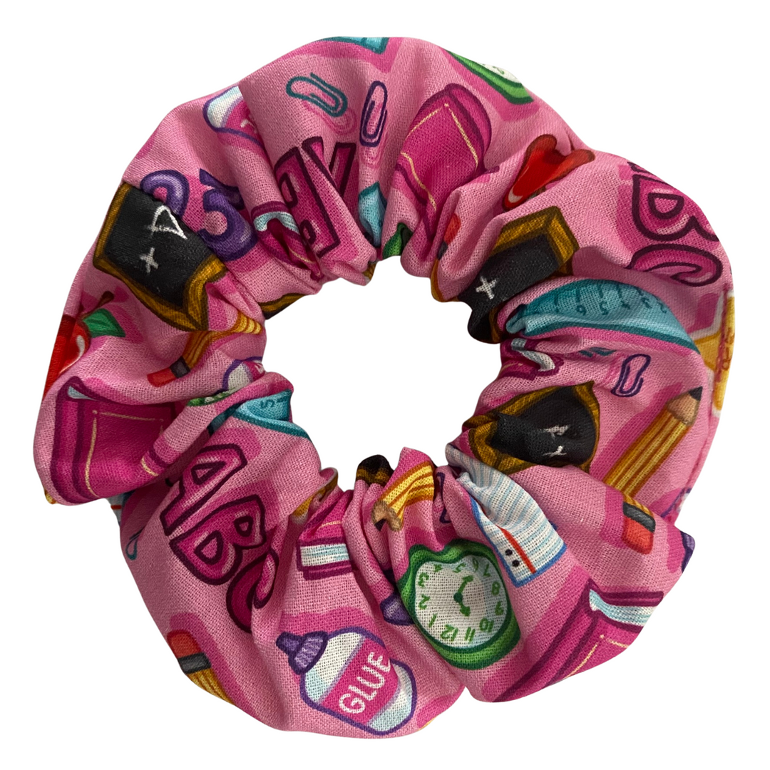School Stuff Scrunchies with fun illustrations of apples, rulers, pencils, glue, and books, it’s a must-have Scrunchie for teachers, teacher aides, and early childhood educators.