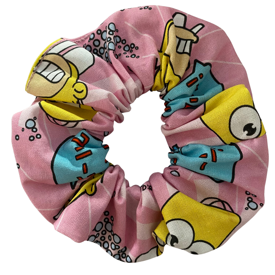 Our Mr. Sparkle Homer Scrunchie is handmade from soft woven cotton fabric and finished with high-quality braided elastic, available in four sizes.