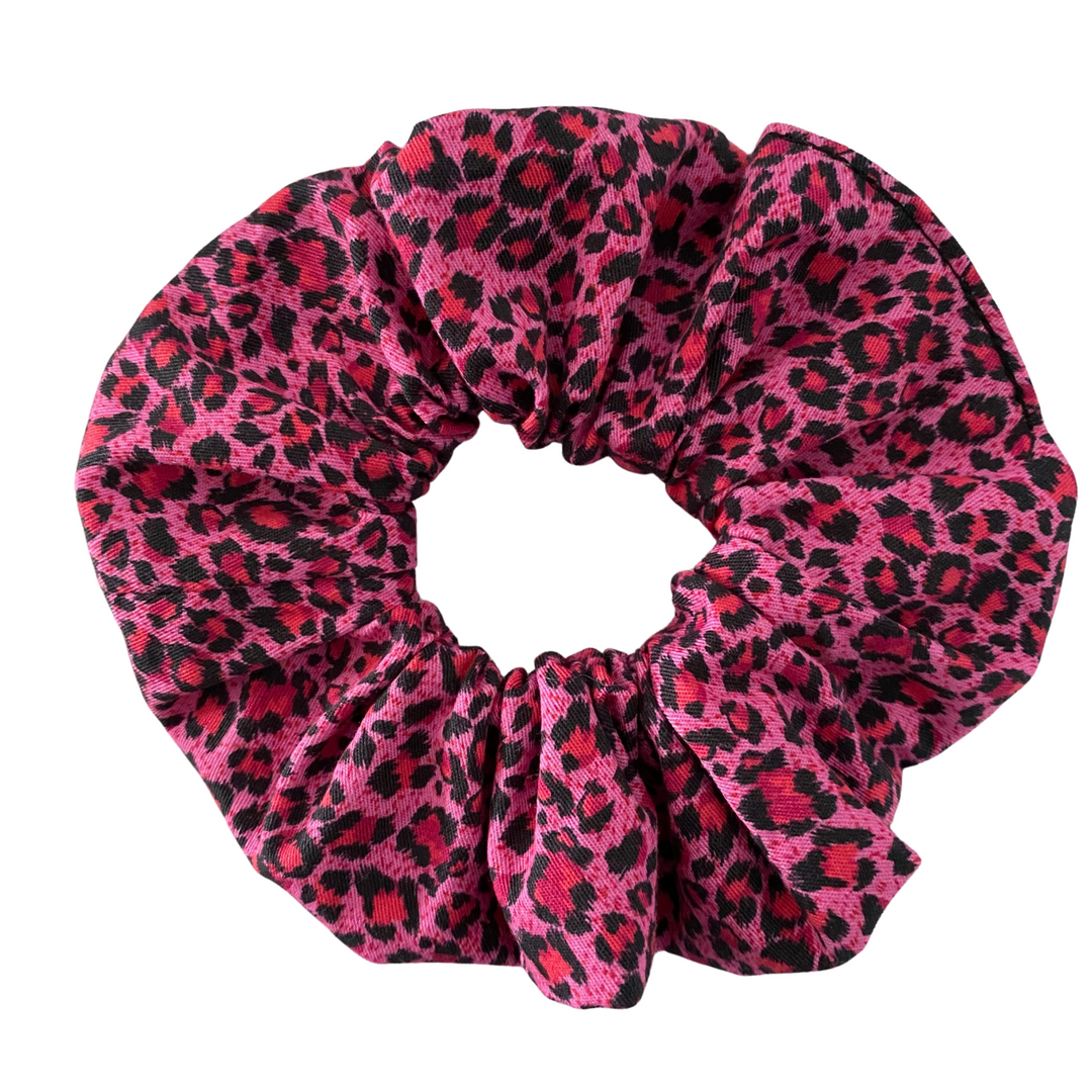 Pink Leopard Scrunchie, handmade from soft cotton woven fabric, this scrunchie features a bold and playful pink leopard print.