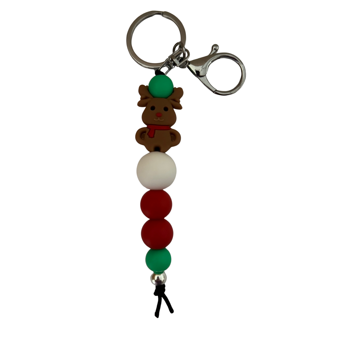 An 18cm Keyring with a reindeer silicone bead and round coloured beads on a white background.