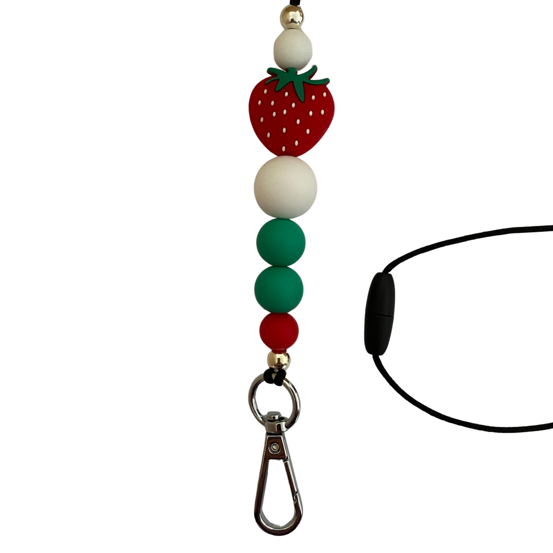 A 60cm lanyard fitted with a safety break away clasp featuring a strawberry bead and other coloured round silicone beads.
