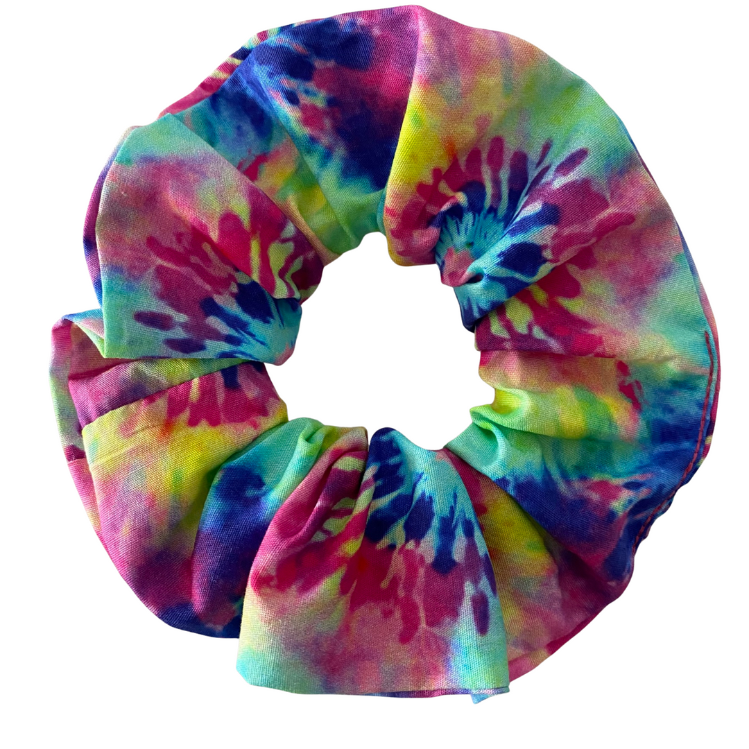Multicolored rainbow tie-dye scrunchie on a white background.