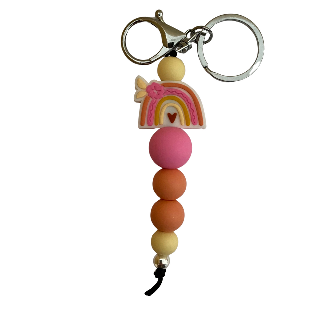 An 18cm keyring with a tropical rainbow and hibiscus flower and other rounded beads.