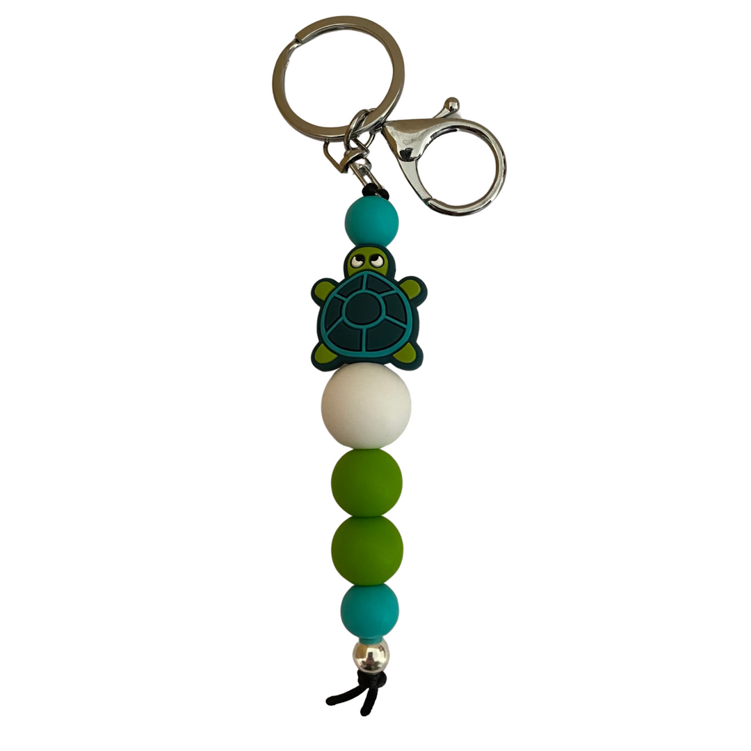 An 18cm keyring with a silicone bead turtle and other coloured round silicone beads.