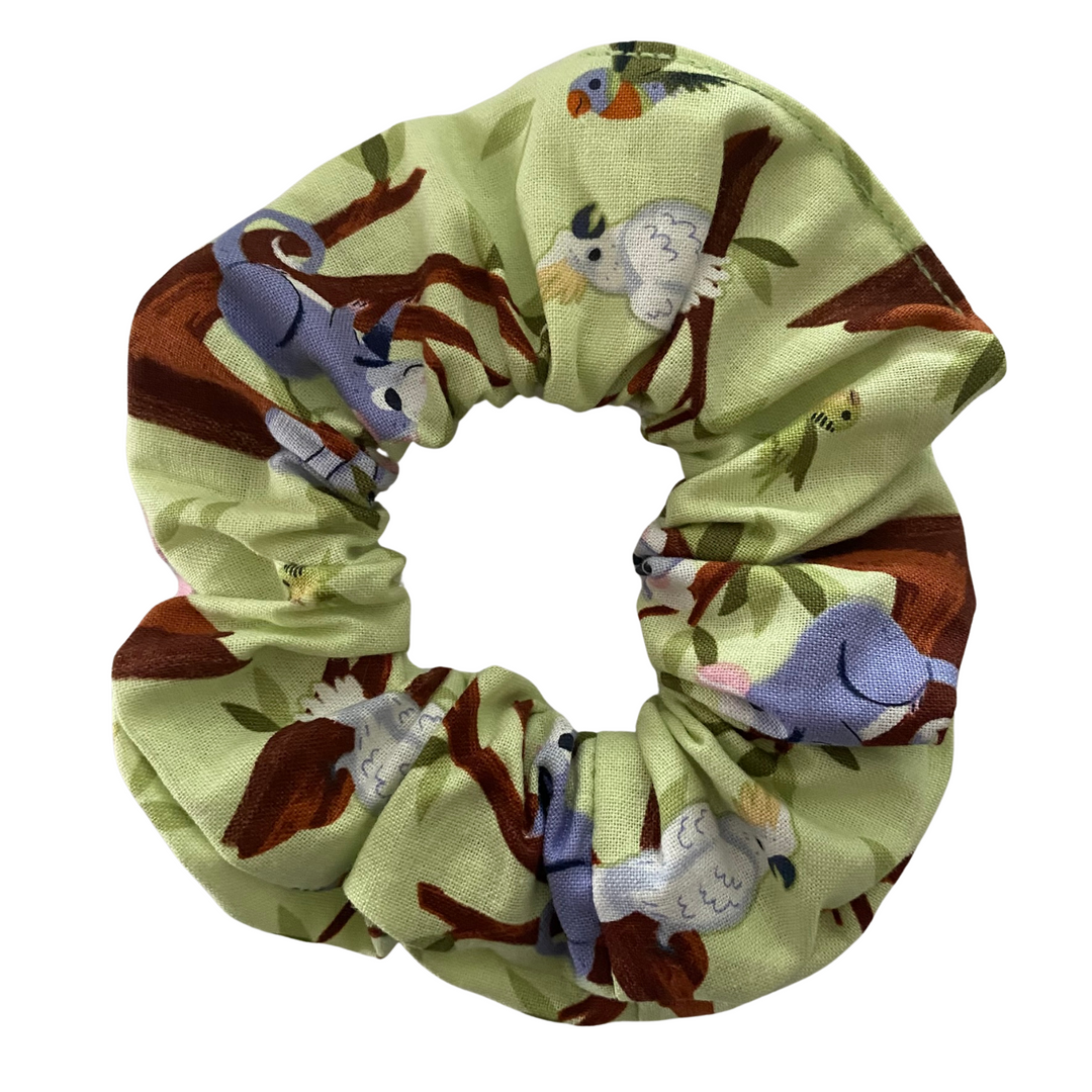 Our Aussie Oz-Born Canopy Critters Scrunchie features beloved tree-dwelling wildlife like Koalas, Ringtail Possums, Cockatoos, Galahs, Rainbow Lorikeets, and Kookaburras.