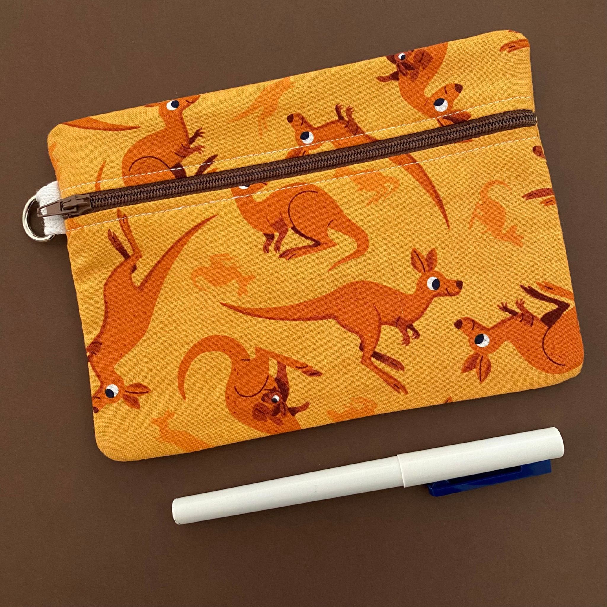 A medium zipper pouch featuring Kangaroos and their Joeys.
