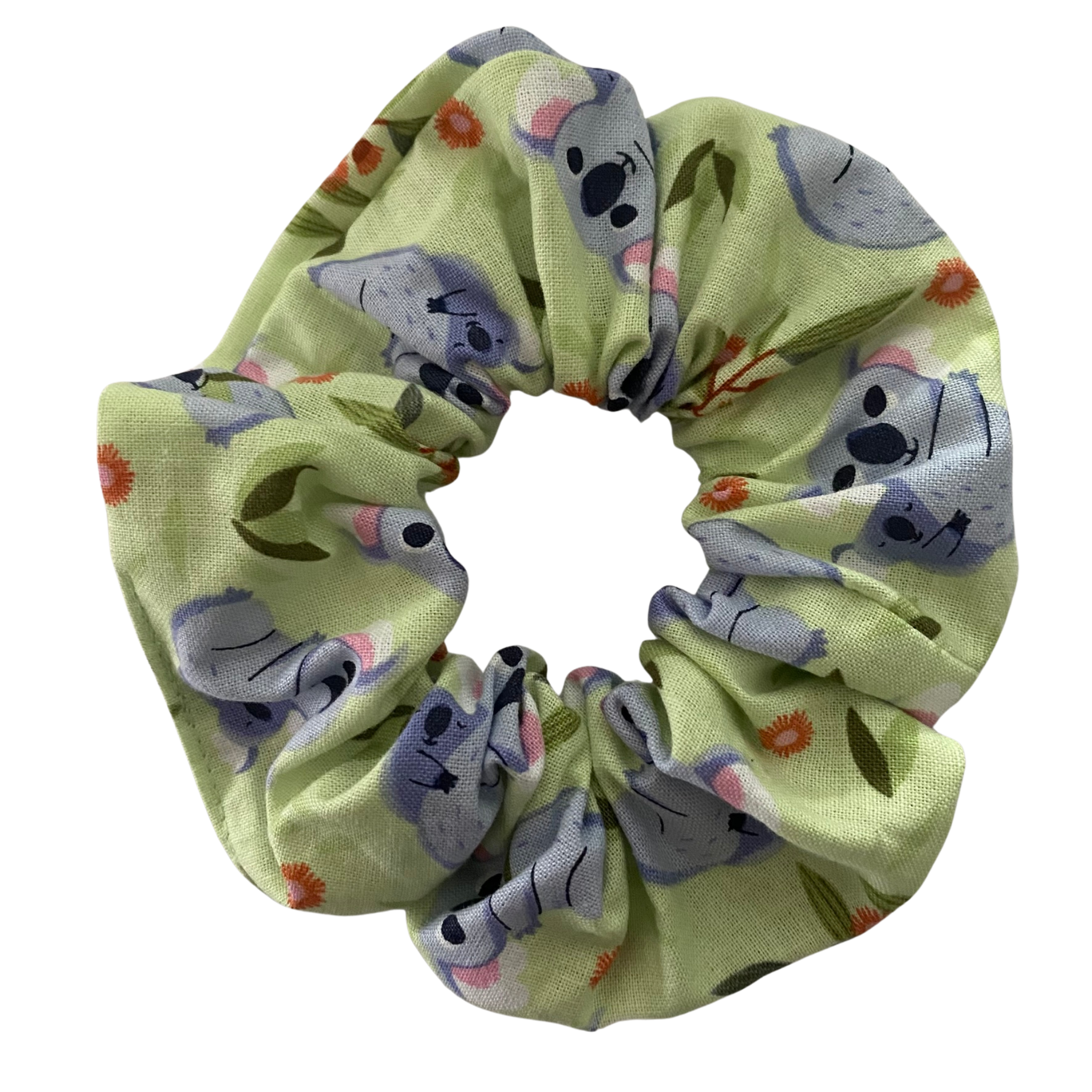 A light green coloured fabric featuring images of cute Koalas.