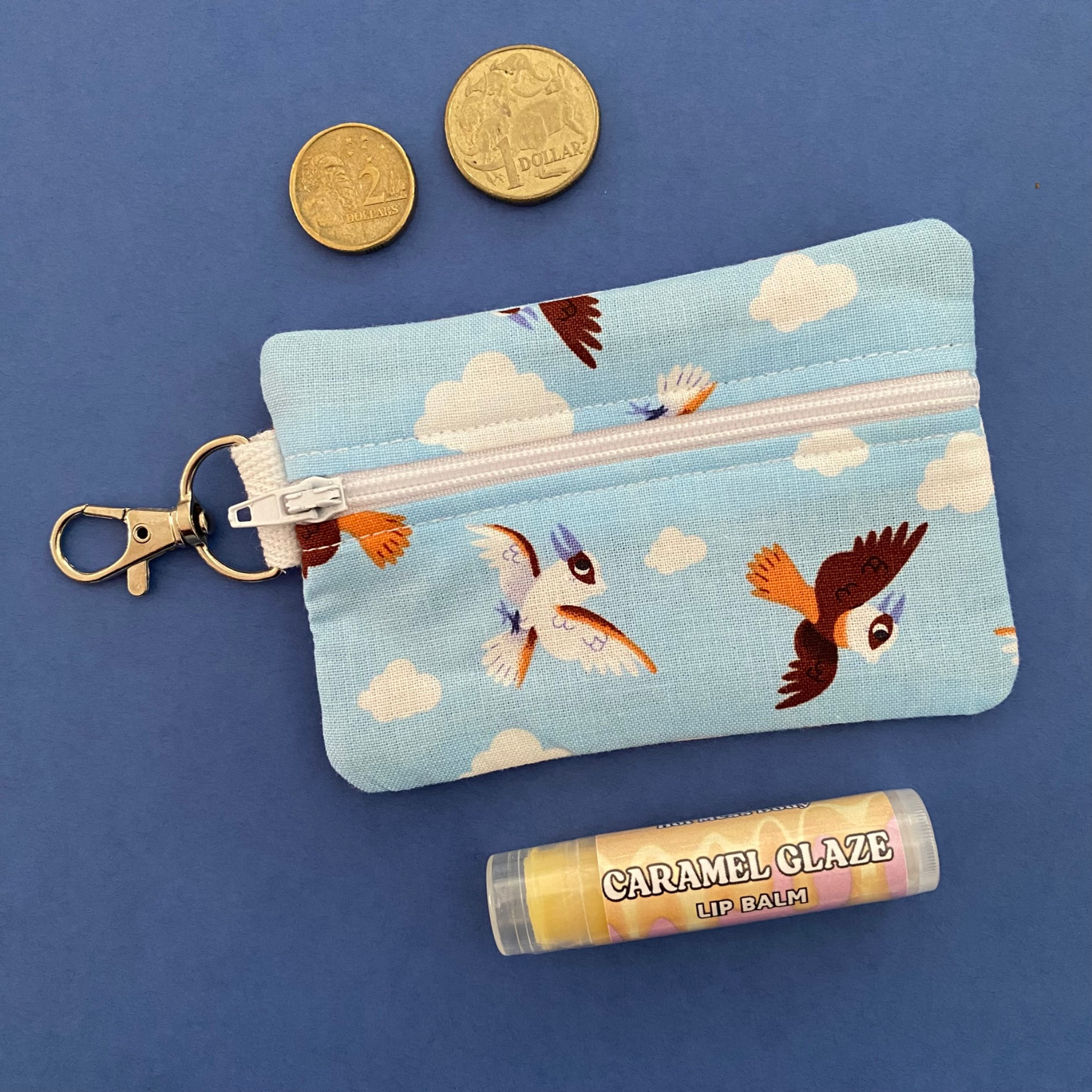 A clip coin purse featuring kookaburras.