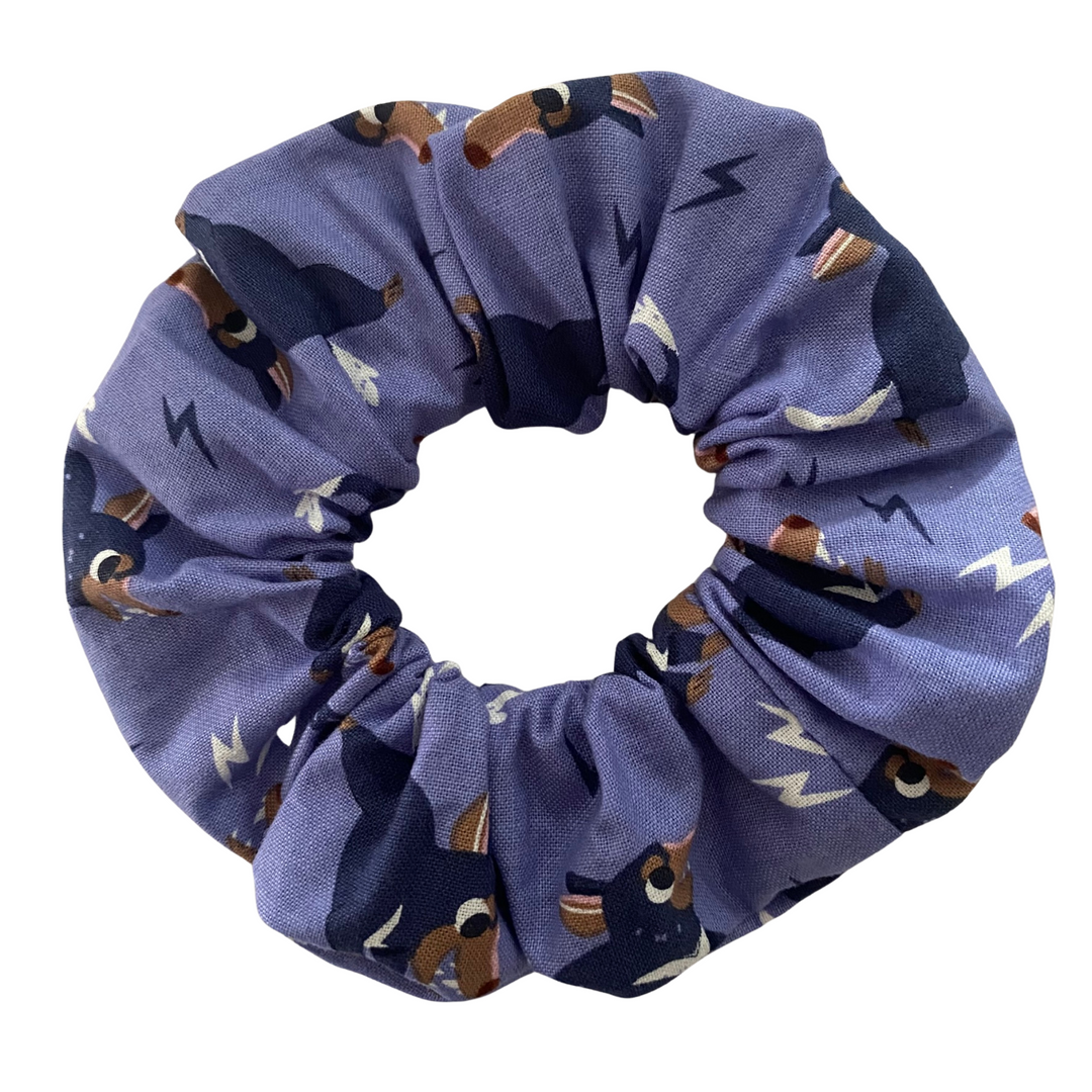 A light purple coloured fabric featuring images of Tassie Devils.