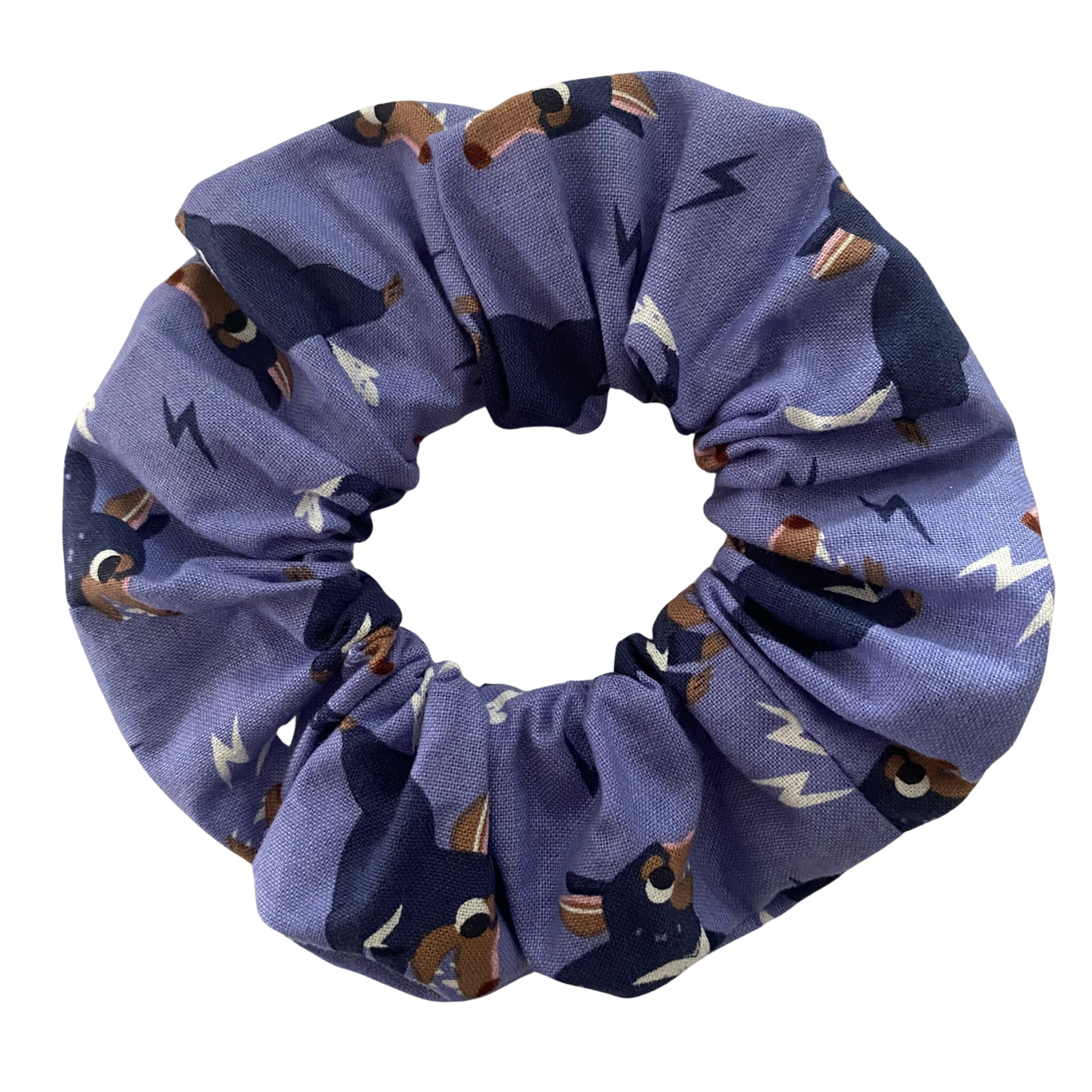 A light purple coloured fabric featuring images of Tassie Devils.