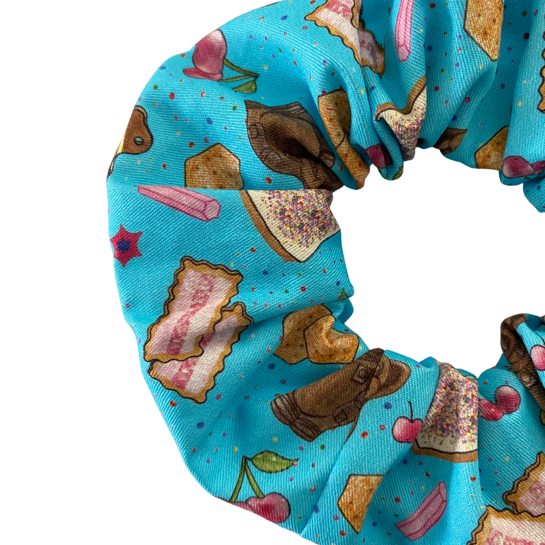 Blue scrunchie featuring a mixture of Aussie snack food.