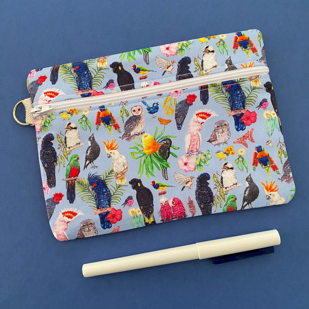 Australian Birds Medium Zipper featuring 19 native birds on a blue fabric.