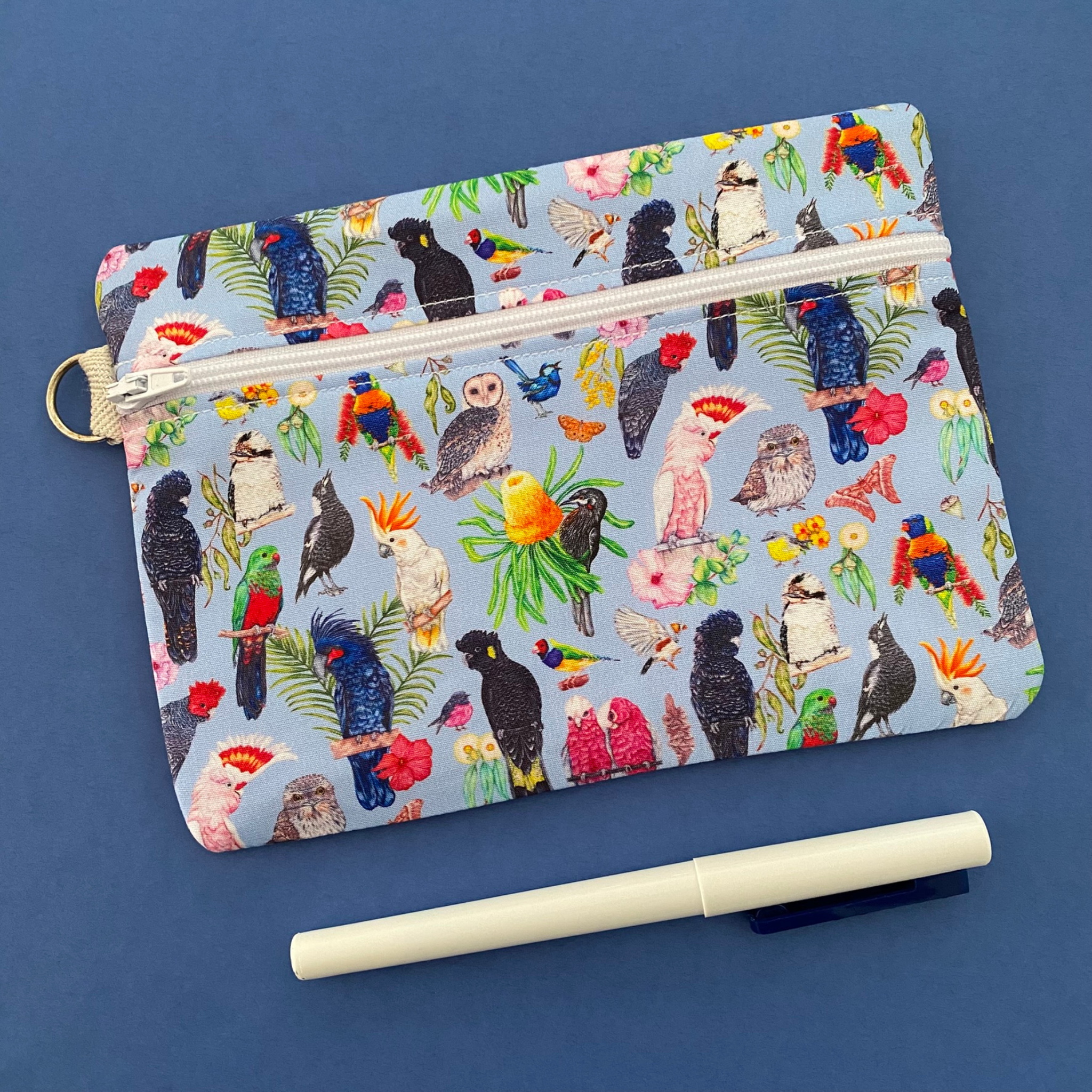 Australian Birds Medium Zipper featuring 19 native birds on a blue fabric.