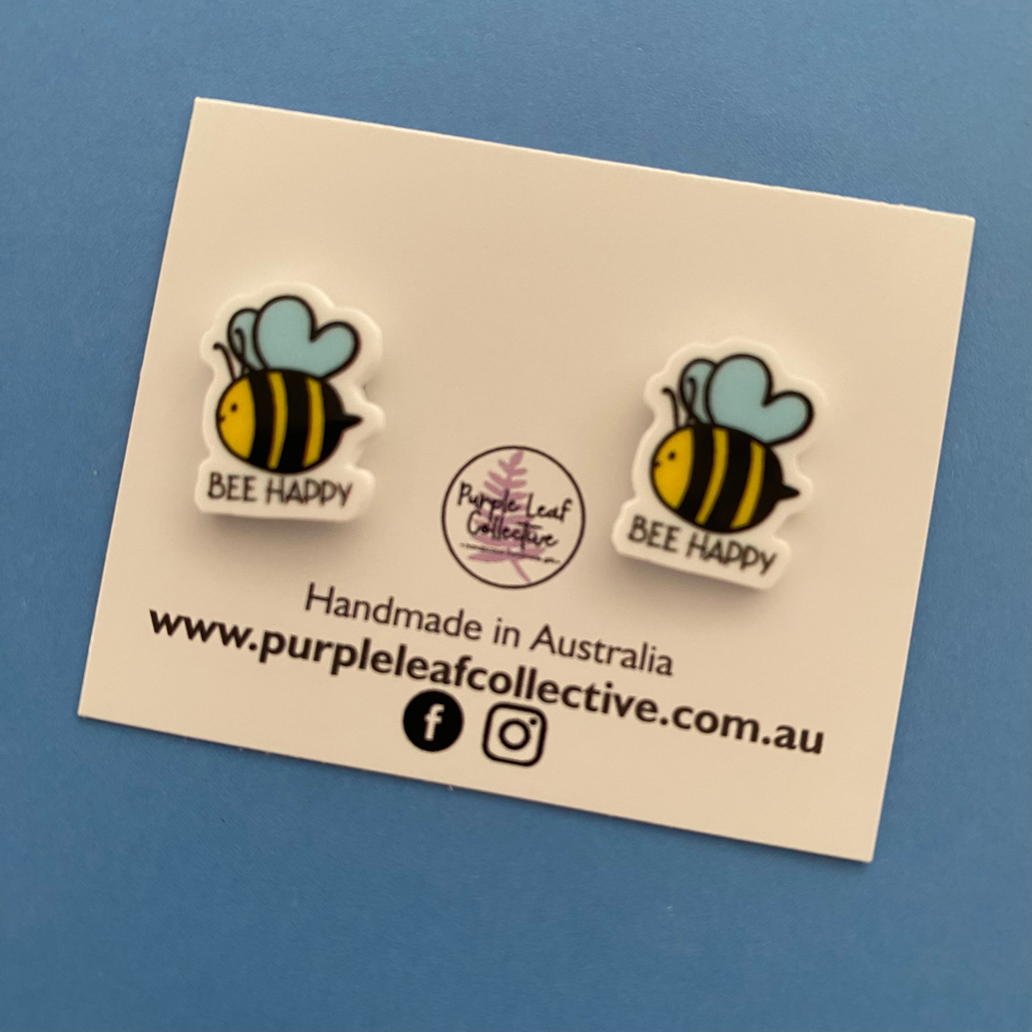 Bee Happy Stud Earrings approx 14mm with a picture of a bee and the words Bee Happy. Handmade with hypoallergenic surgical steel posts, safe for sensitive ears.