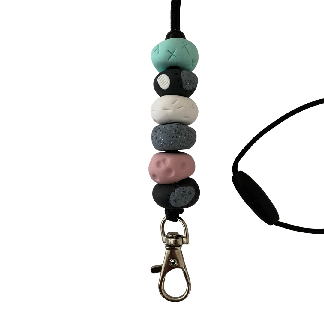 Handmade polymer clay lanyard with six hand-rolled beads in mint, dusty pink and grey. Threaded on a nylon cord with a breakaway safety clasp and a silver-plated clip.