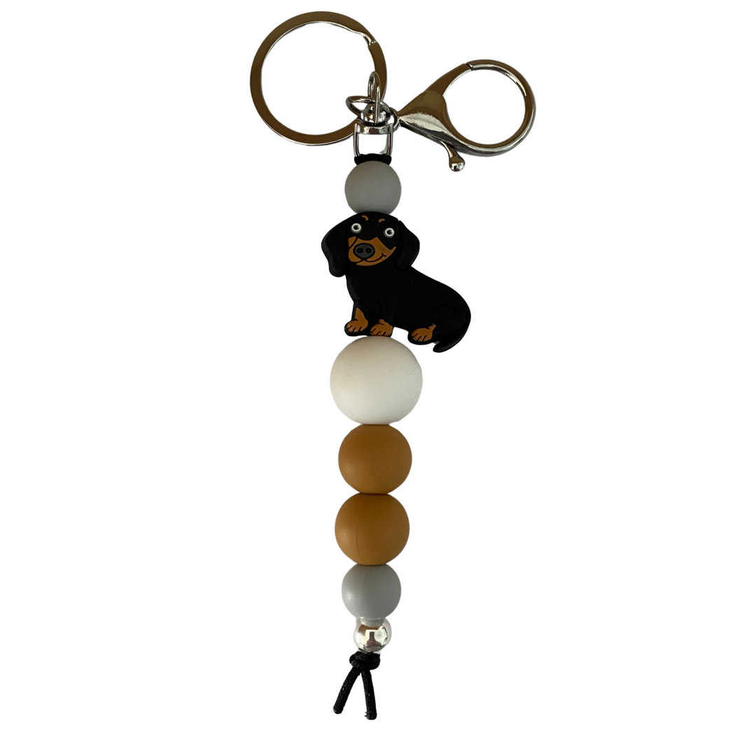 Black Sausage Dog silicone bead keyring with coloured silicone beads, a 10mm aluminum bead, and durable nylon cord. Perfect for keys or bags.