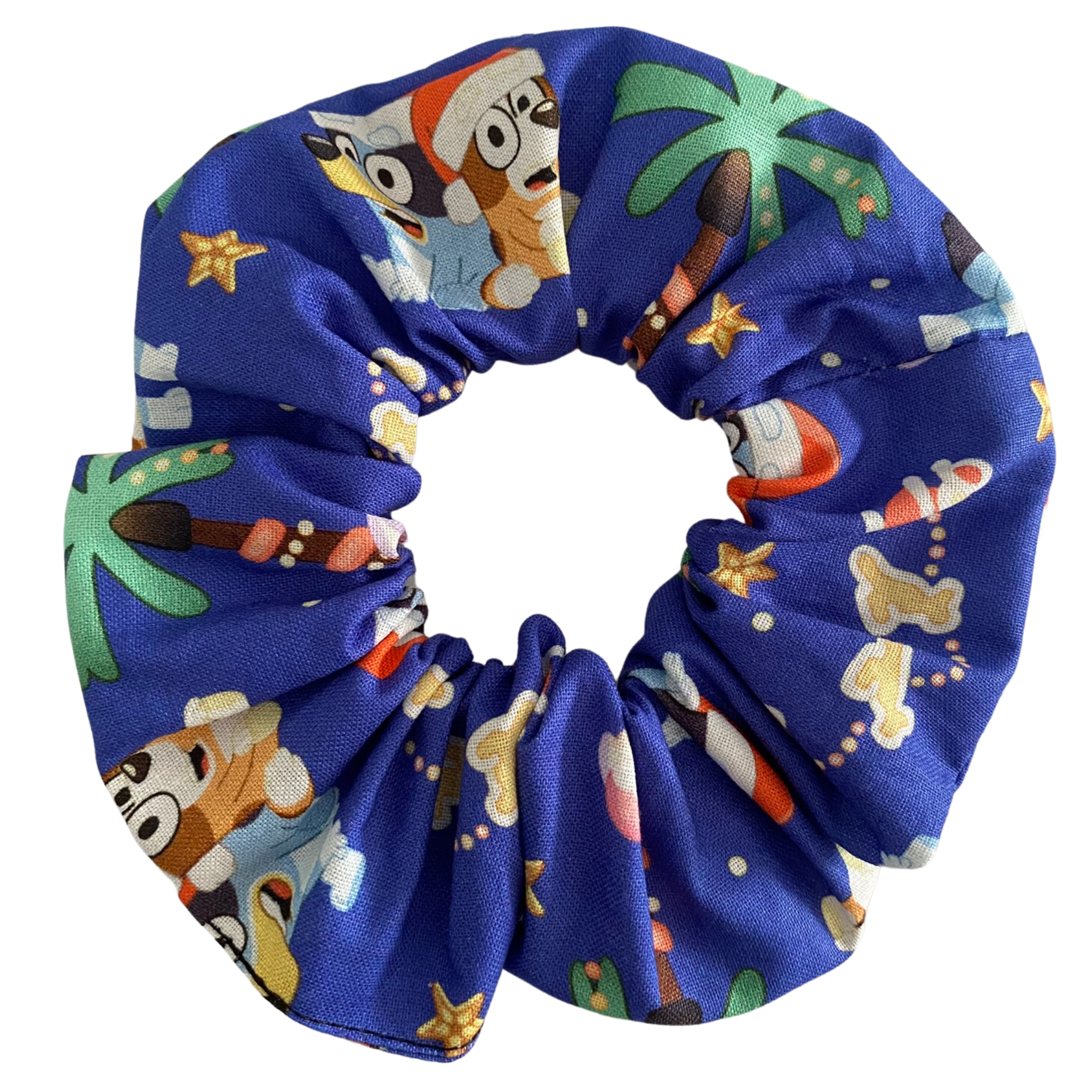Bluey and Bingo wearing Santa hats scrunchie on a dark blue fabric.