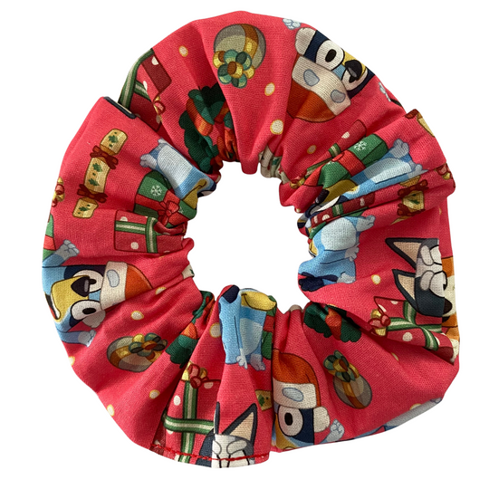 Red scrunchie with Bluey and Bingo character pattern on a white background.