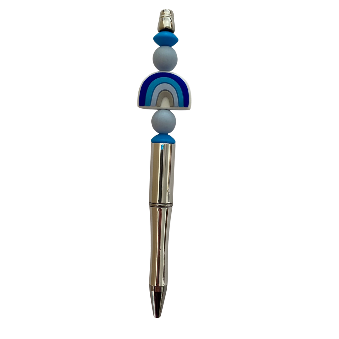 Pen with decorative blue and grey rainbow beads on a white background.