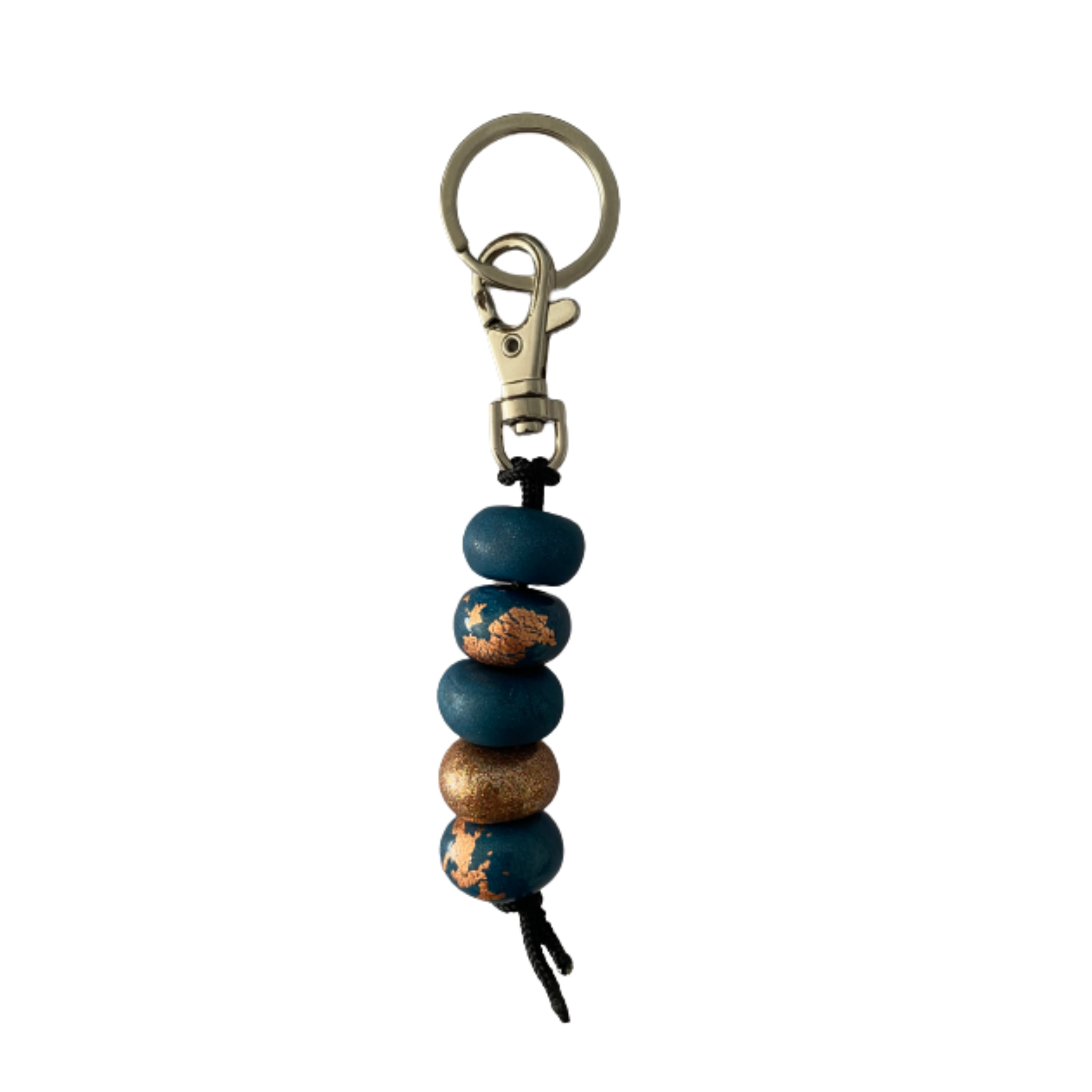 Handmade polymer clay keyring featuring five hand-rolled beads in a mix of navy blues and gold glitter accents, attached to a silver clasp.