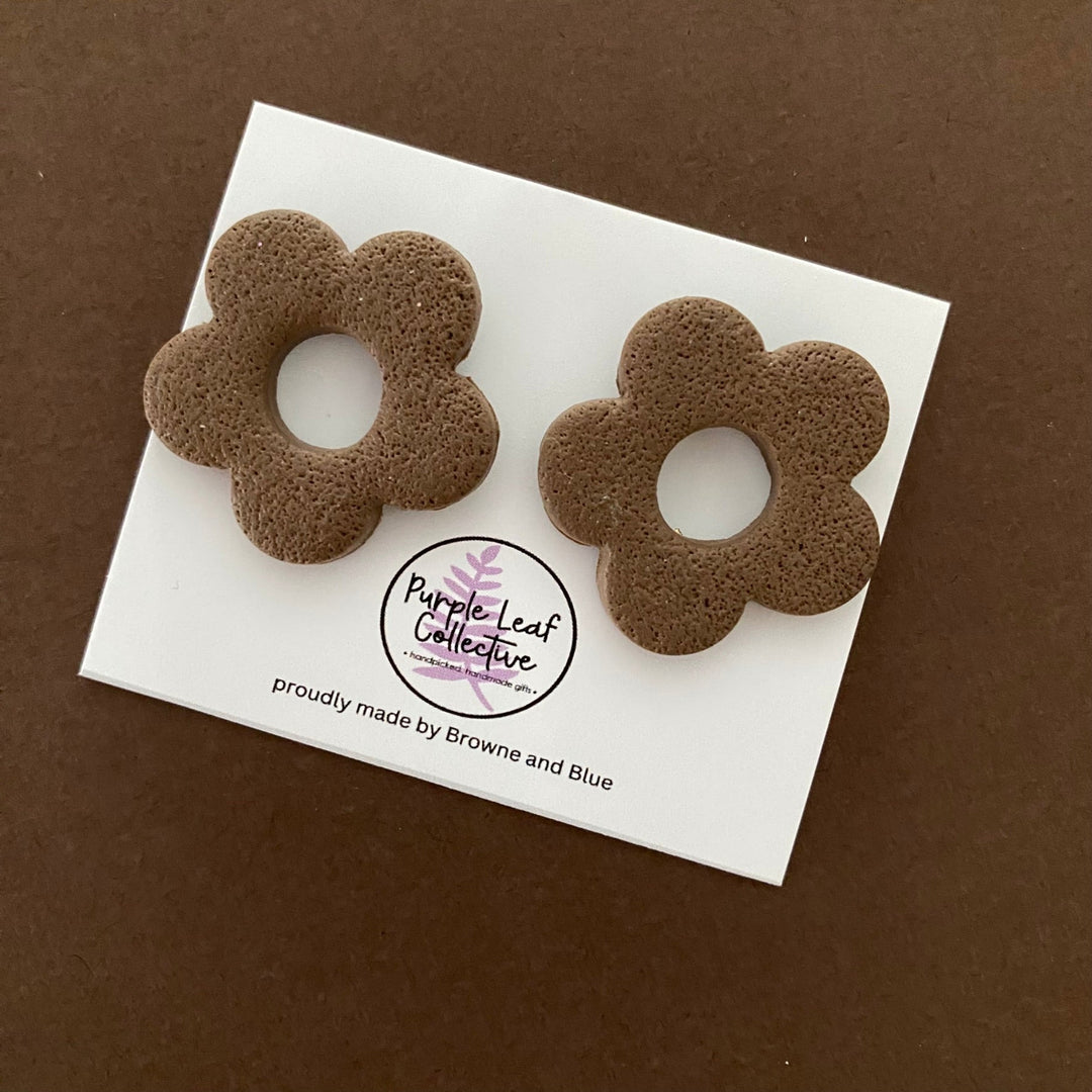 Drop stud earrings with five brown polymer clay flower petals, set on surgical steel posts for comfort and durability.