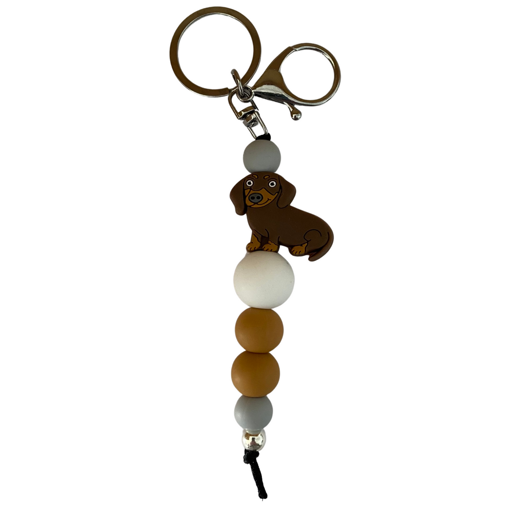 Brown Sausage Dog silicone bead keyring with coloured silicone beads, a 10mm aluminum bead, and durable nylon cord. Perfect for keys or bags.