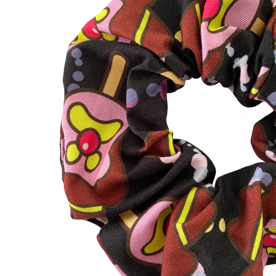 Images of Bubble O’Bill ice cream man on black fabric.