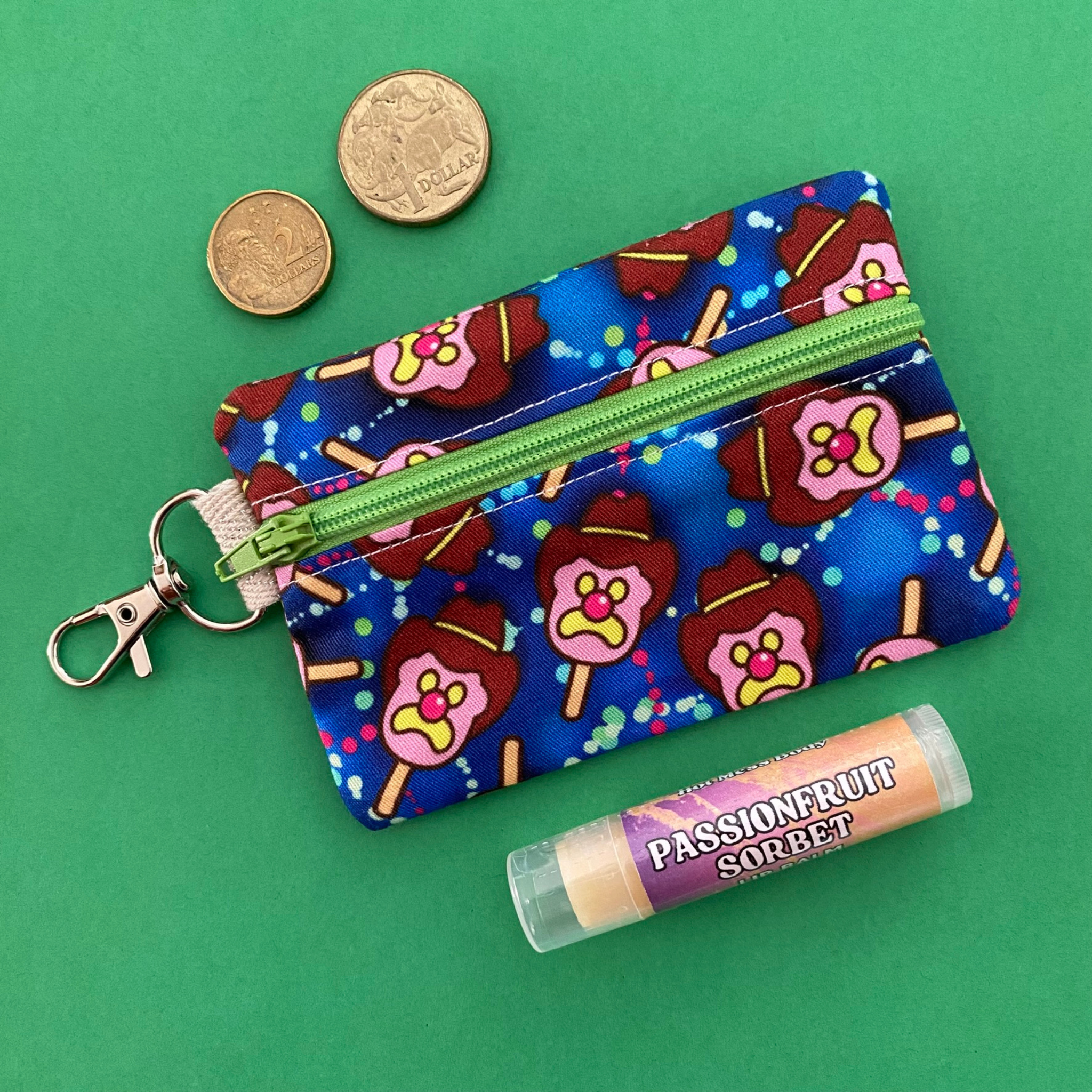 Bubble O'Bill Dark Blue fabric with images of Bubble O'Bill.  It includes a sewn-in tag and a sturdy D-ring with a silver-plated clasp—perfect for clipping to your keys, bag, lanyard, or even your pup’s collar. 