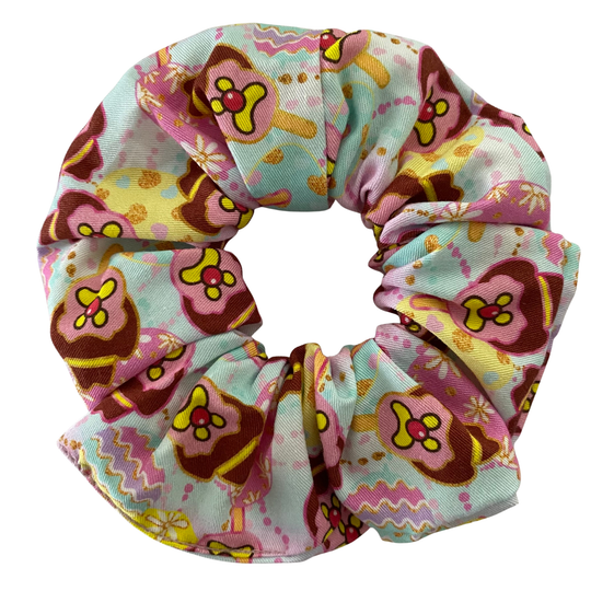 A scrunchie featuring Bubble O'Bill and Easter eggs on a pastel background.