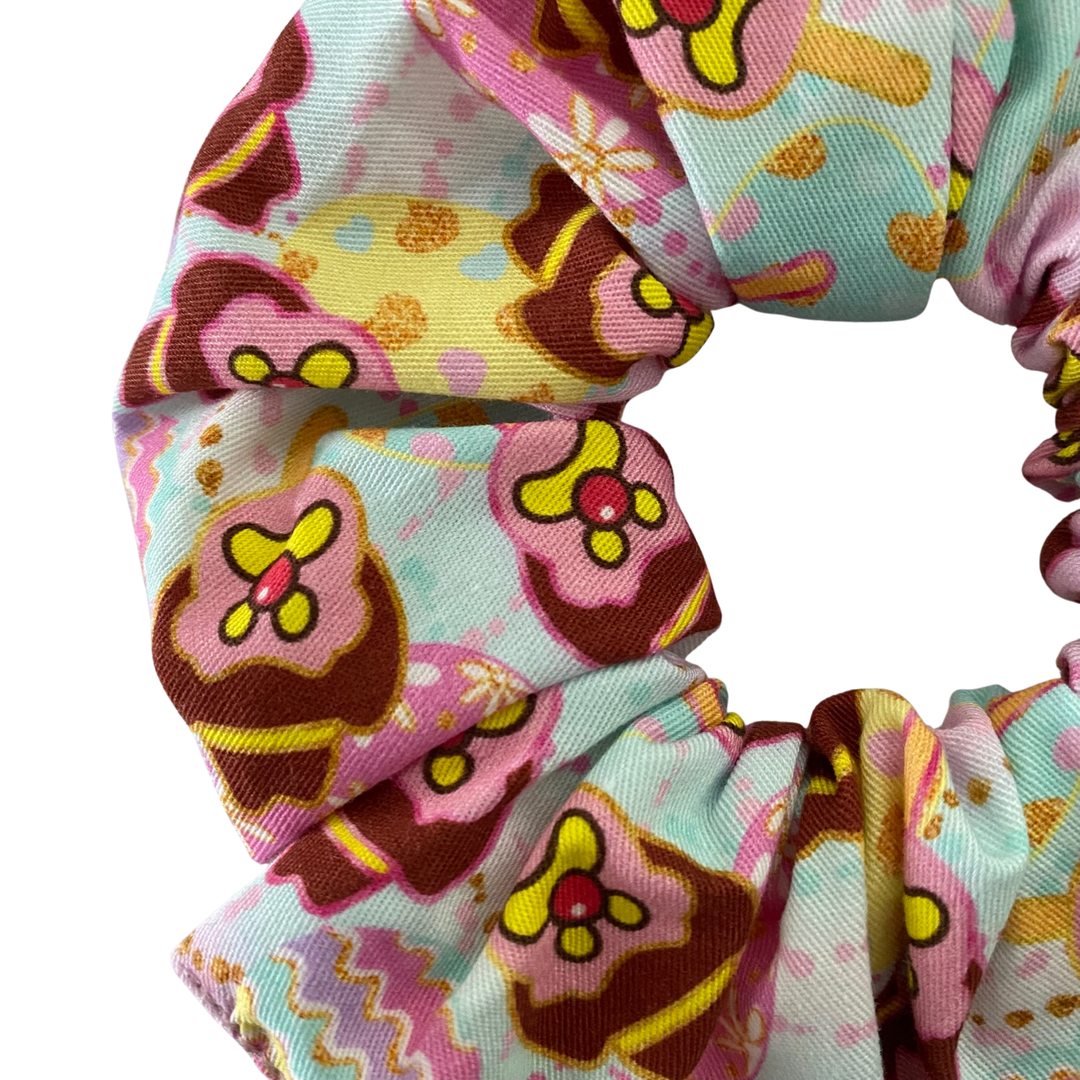 A scrunchie with pastel colours featuring Bubble O'Bill and Easter eggs.