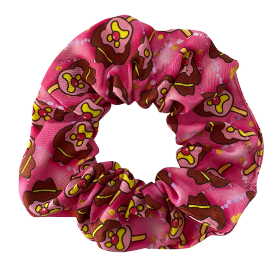 Hot pink scrunchie with Bubble O'Bill character pattern on a white background.