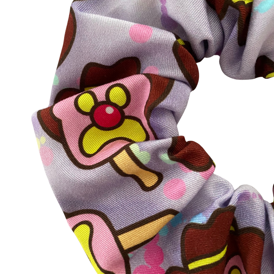 Images of Bubble O’Bill ice cream man on lilac fabric.