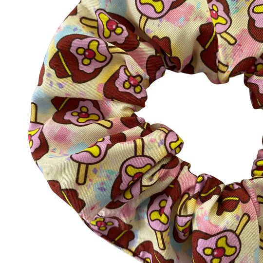 Images of Bubble O’Bill ice cream man on pastel yellow fabric.