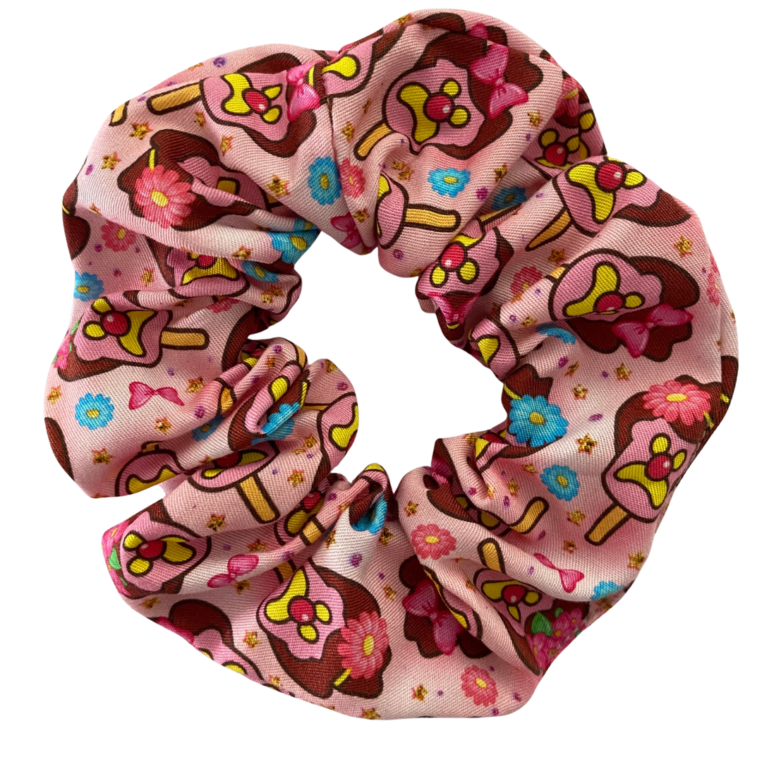 Pink scrunchie featuring images of Bubble O'Bill ice cream man wearing pink bows and flowers.