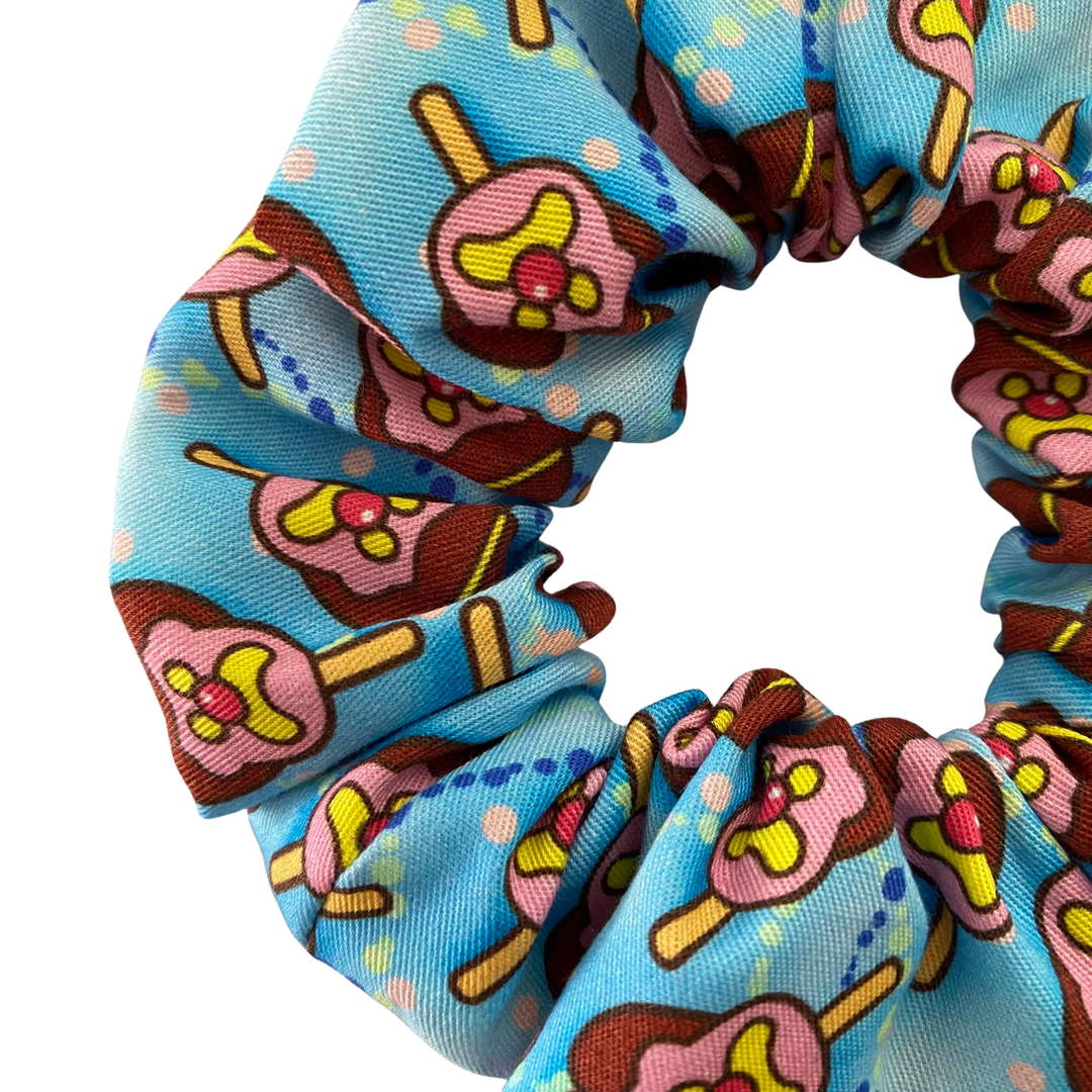 Images of Bubble O’Bill ice cream man on sky blue fabric.