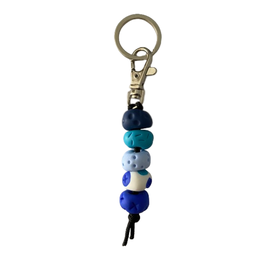 Handmade polymer clay keyring with five hand-rolled beads in blue colours, attached to a silver clasp and split ring.