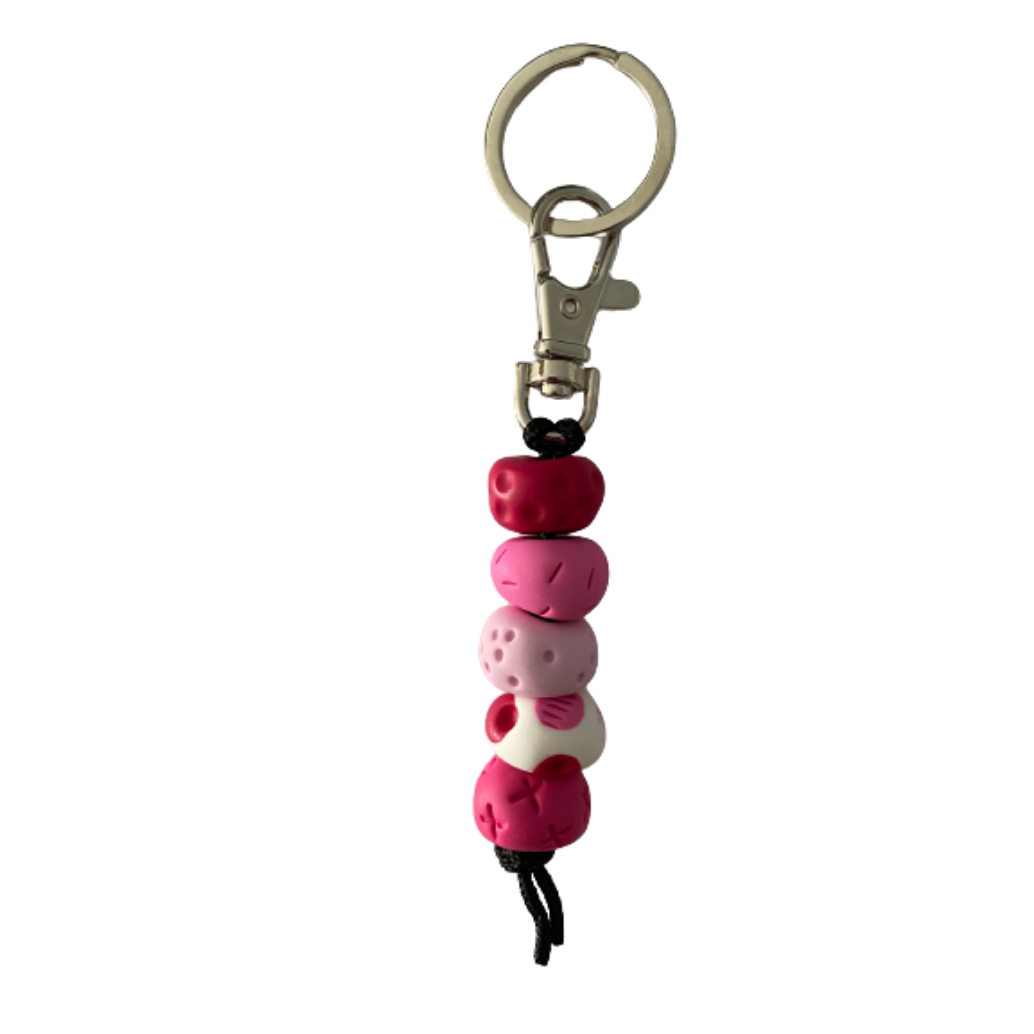 Handmade polymer clay keyring with five hand-rolled beads in pink colours, attached to a silver clasp and split ring.