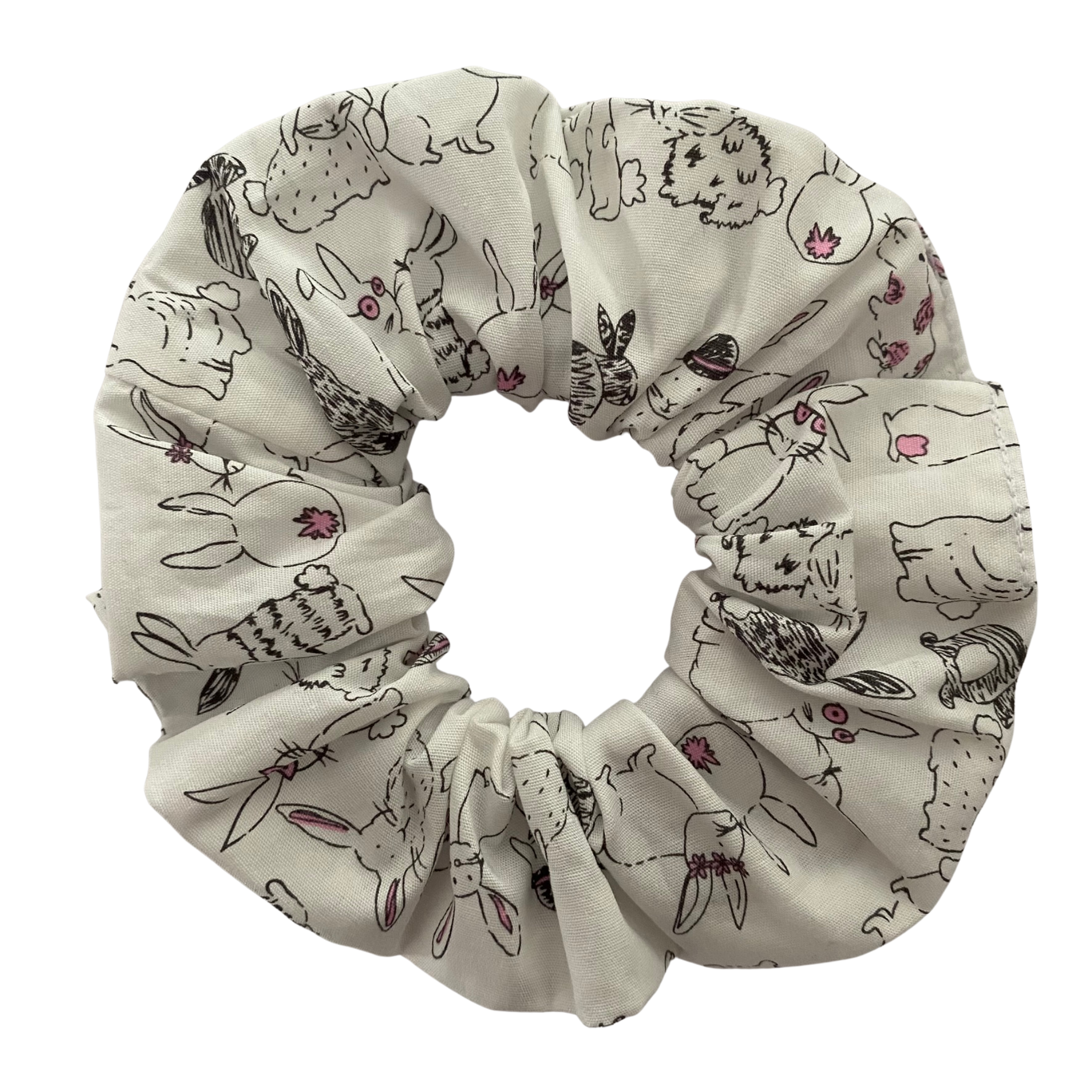 A scrunchie featuring adorable rabbit illustrations on crisp white fabric.